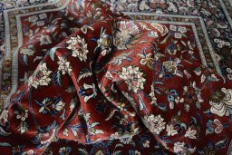 Surface texture of 1970s Ghom rug with natural Silk and intricate pattern