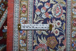 Backside of handmade 1970s Ghom rug showing knot structure and weave density