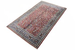 Corner detail of 1970s Ghom rug showing border pattern and Silk pile