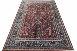 Surface texture of 1970s Ghom rug with natural Silk and intricate pattern