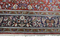 Full view of 1970s Ghom rug from Iran / Persia, 218 × 136 cm in Red tones