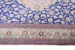 Corner detail of 2000s Ghom rug showing border pattern and Silk pile