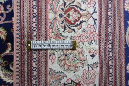 Close-up detail of 2000s Ghom rug from Iran / Persia showing Silk weave