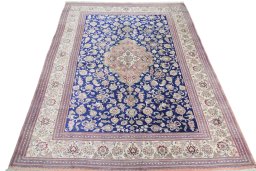 Surface texture of 2000s Ghom rug with natural Silk and intricate pattern