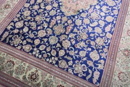 Close-up detail of 2000s Ghom rug from Iran / Persia showing Silk weave