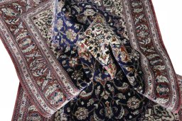 Surface texture of 2000s Ghom rug with natural Silk and intricate pattern