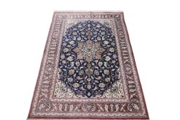 Surface texture of 2000s Ghom rug with natural Silk and intricate pattern