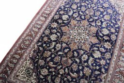 Backside of handmade 2000s Ghom rug showing knot structure and weave density
