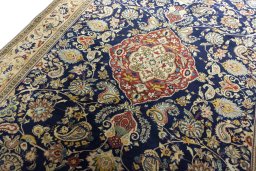 Backside of handmade New Ghom rug showing knot structure and weave density