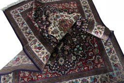 Surface texture of 1970s Ghom rug with natural Silk and intricate pattern