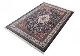 Corner detail of 1970s Ghom rug showing border pattern and Silk pile