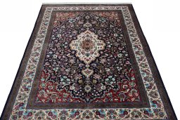 Surface texture of 1970s Ghom rug with natural Silk and intricate pattern