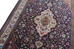 Backside of handmade 1970s Ghom rug showing knot structure and weave density