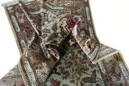 Surface texture of 2000s Ghom rug with natural Silk and intricate pattern