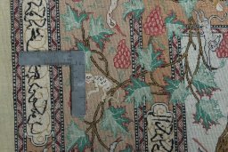 Backside of handmade 2000s Ghom rug showing knot structure and weave density