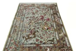 Surface texture of 2000s Ghom rug with natural Silk and intricate pattern