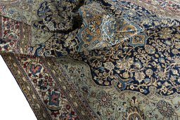 Surface texture of 1970s Ghom rug with natural Cork and intricate pattern