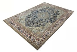 Corner detail of 1970s Ghom rug showing border pattern and Cork pile