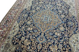 Backside of handmade 1970s Ghom rug showing knot structure and weave density