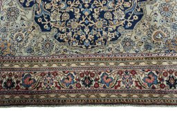 Full view of 1970s Ghom rug from Iran / Persia, 325 × 225 cm in Blue tones