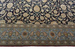 Corner detail of 1950s Ghom rug showing border pattern and Cork pile