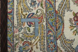 Close-up detail of 1950s Ghom rug from Iran / Persia showing Wool weave
