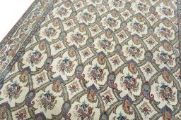 Backside of handmade 1950s Ghom rug showing knot structure and weave density