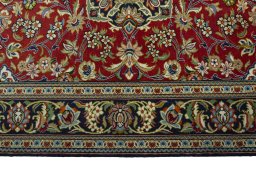 Corner detail of 2000s Ghom rug showing border pattern and Cork pile