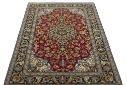 Surface texture of 2000s Ghom rug with natural Cork and intricate pattern