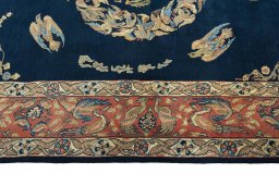 Corner detail of 1970s Ghom rug showing border pattern and Wool pile