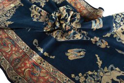 Surface texture of 1970s Ghom rug with natural Wool and intricate pattern