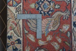 Backside of handmade 1970s Ghom rug showing knot structure and weave density
