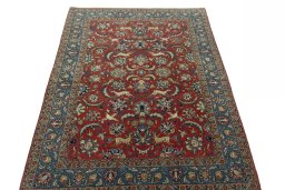 Surface texture of 1970s Ghom rug with natural Wool and intricate pattern