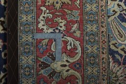 Surface texture of 1970s Ghom rug with natural Cork and intricate pattern
