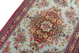 Backside of handmade New Ghom rug showing knot structure and weave density