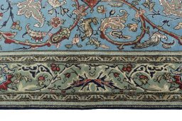 Corner detail of 1970s Ghom rug showing border pattern and Wool pile