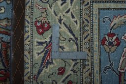 Backside of handmade 1970s Ghom rug showing knot structure and weave density