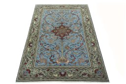 Surface texture of 1970s Ghom rug with natural Wool and intricate pattern