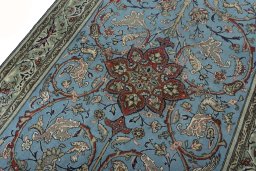 Backside of handmade 1970s Ghom rug showing knot structure and weave density