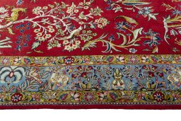 Corner detail of 1970s Ghom rug showing border pattern and Wool pile