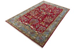 Corner detail of 1970s Ghom rug showing border pattern and Wool pile