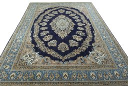 Surface texture of 2000s Ghom rug with natural Wool and intricate pattern