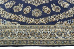 Corner detail of 2000s Ghom rug showing border pattern and Wool pile