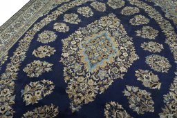 Backside of handmade 2000s Ghom rug showing knot structure and weave density