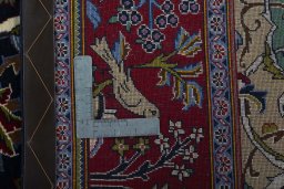 Backside of handmade New Ghom rug showing knot structure and weave density