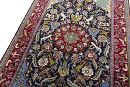 Backside of handmade New Ghom rug showing knot structure and weave density