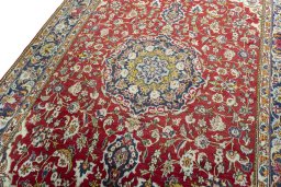 Backside of handmade 2000s Ghom rug showing knot structure and weave density