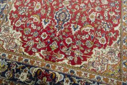 Close-up detail of 2000s Ghom rug from Iran / Persia showing Wool weave