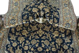 Surface texture of 1950s Ghom rug with natural Cork and intricate pattern