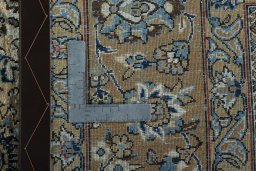 Backside of handmade 1950s Ghom rug showing knot structure and weave density